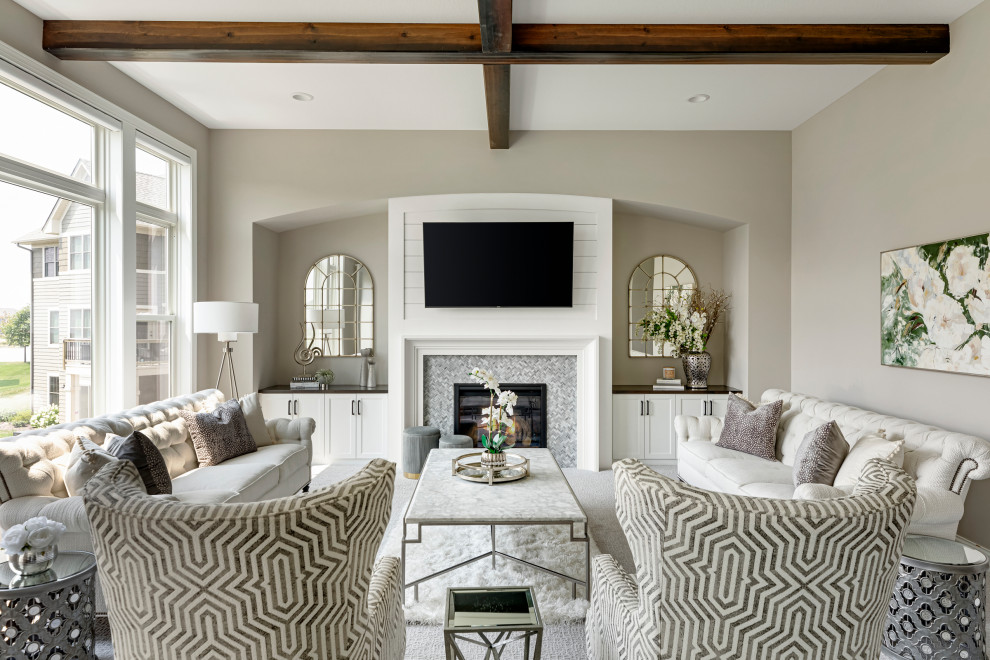 Large transitional formal open concept living room in Minneapolis with beige walls, carpet, a standard fireplace, a tile fireplace surround, a wall-mounted tv, white floor and exposed beam.