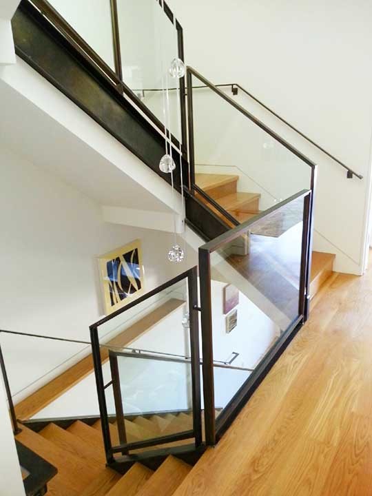 Photo of a mid-sized modern wood straight staircase in San Francisco with open risers.