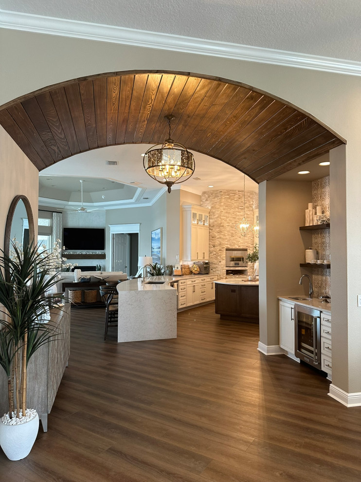 Transitional wood ceiling kitchen photo in Orlando with white backsplash