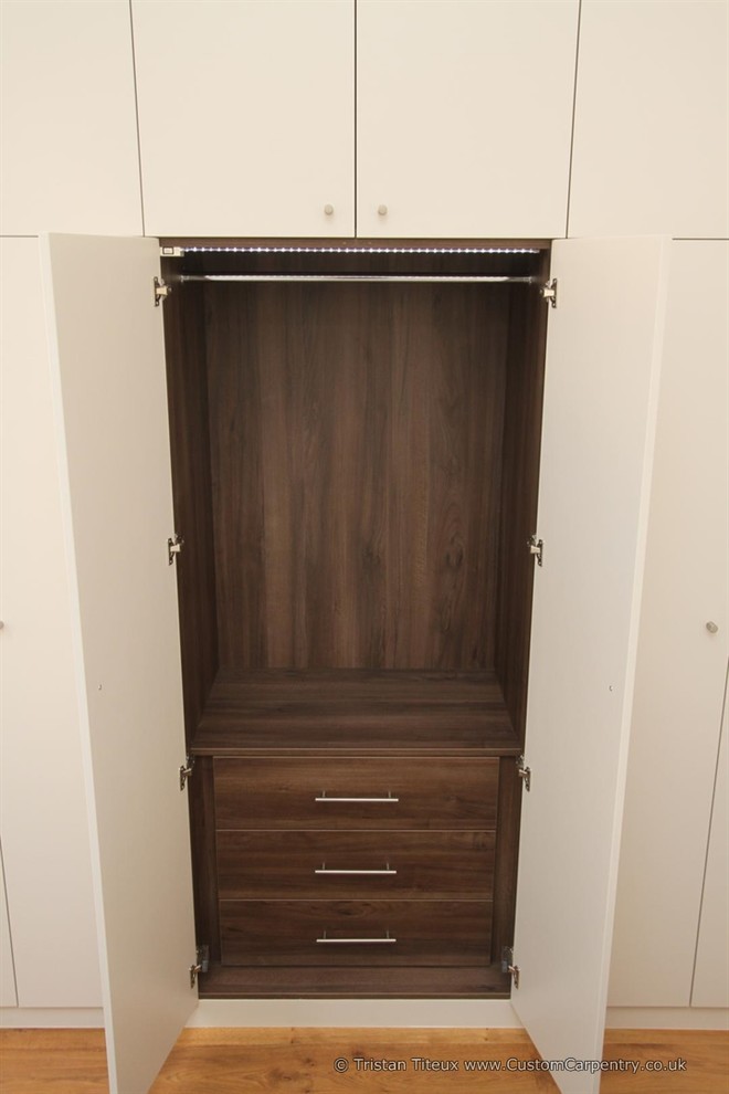 Design ideas for a large contemporary storage and wardrobe in London.