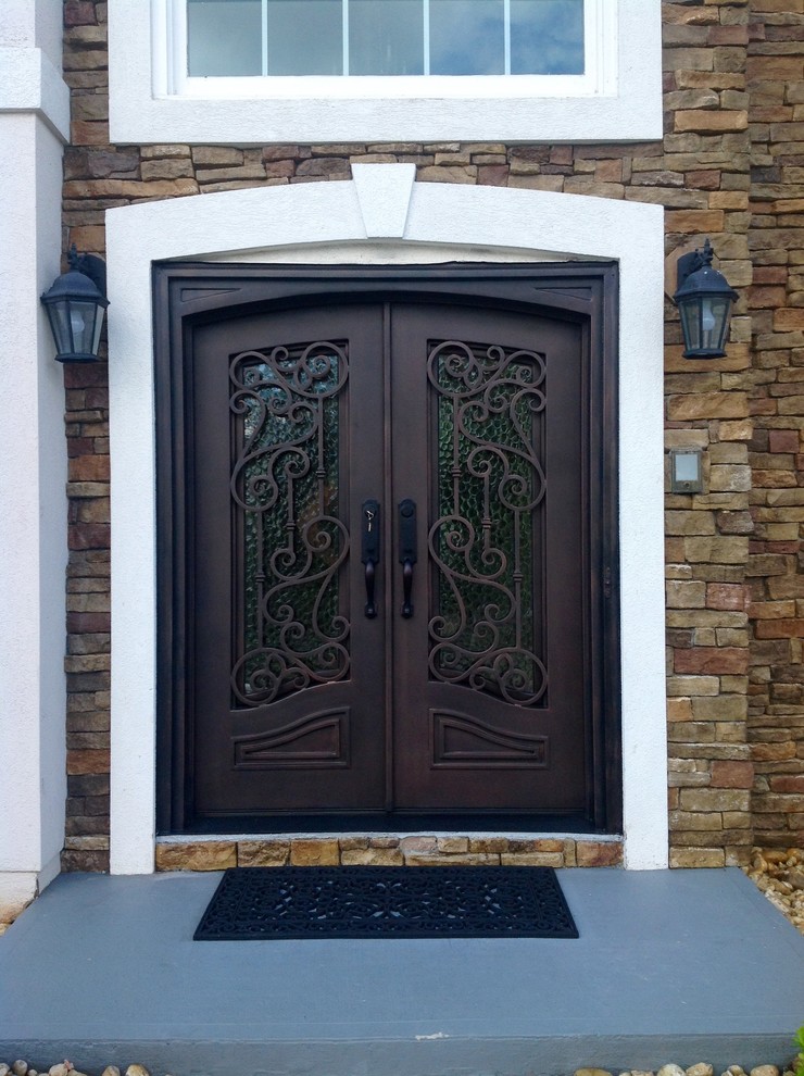 Large transitional front door in Atlanta with a double front door and a metal front door.
