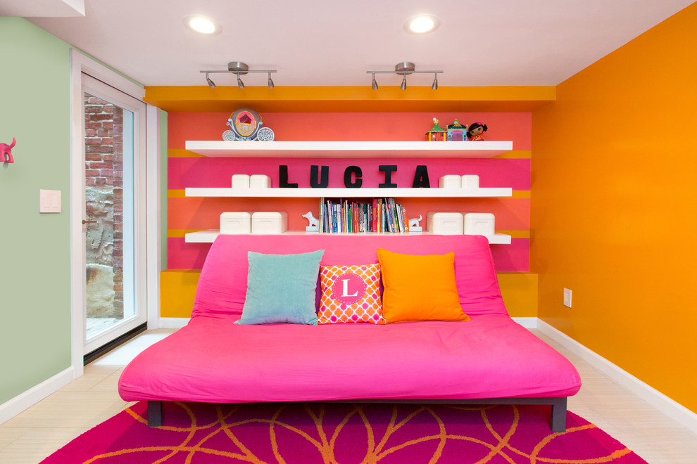 Mid-sized contemporary kids' room in DC Metro with blue walls for girls.