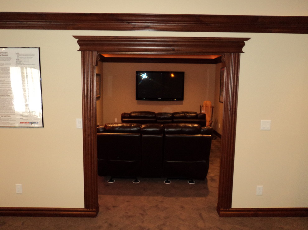 Home theater - rustic home theater idea in Cedar Rapids