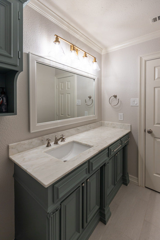 Small classic cloakroom in Dallas with raised-panel cabinets, green cabinets, a two-piece toilet, white walls, marble flooring, a submerged sink, marble worktops, grey floors, white worktops and a built in vanity unit.