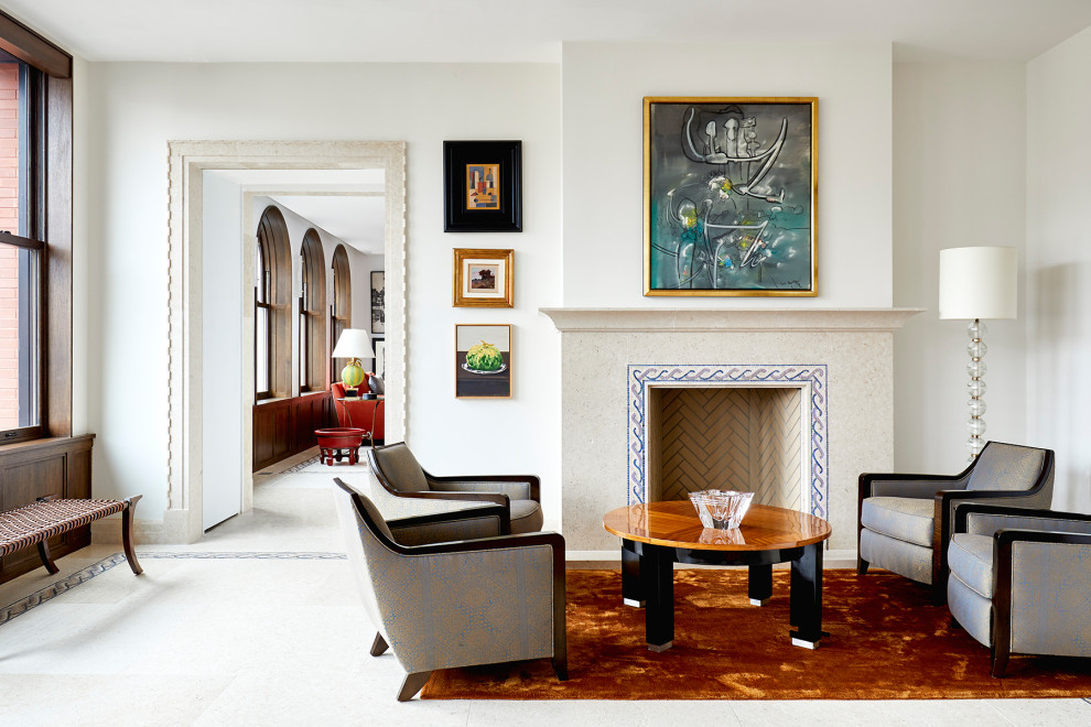 Example of a large eclectic formal and loft-style ceramic tile and white floor living room design in New York with white walls, a standard fireplace, a stone fireplace and no tv