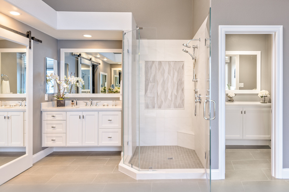 Inspiration for a large traditional master bathroom in San Francisco with shaker cabinets, white cabinets, an undermount tub, gray tile, porcelain tile, grey walls, porcelain floors, an undermount sink and engineered quartz benchtops.