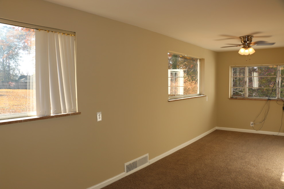 Inspiration for a mid-sized timeless open concept carpeted home design remodel with beige walls