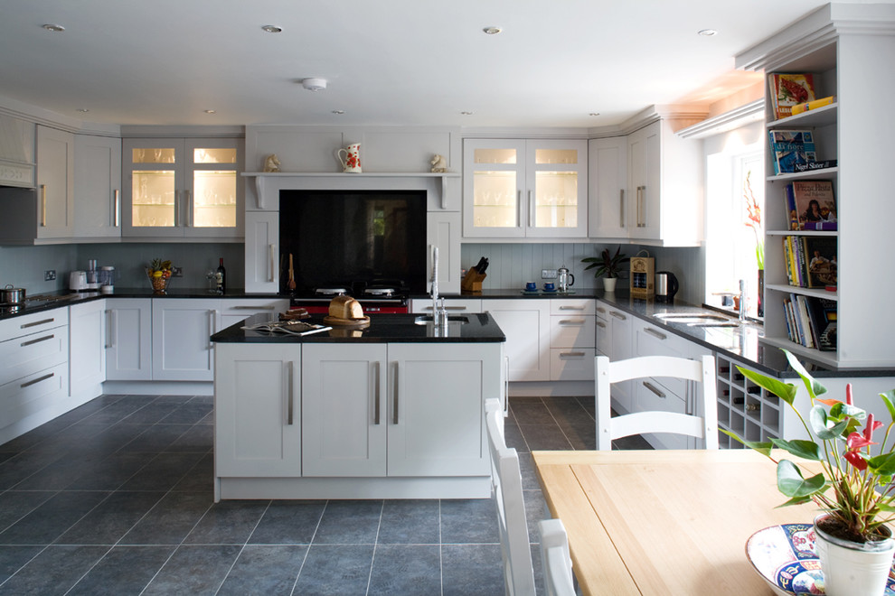 Transitional eat-in kitchen in Other with glass-front cabinets, white cabinets, black splashback, glass sheet splashback and coloured appliances.