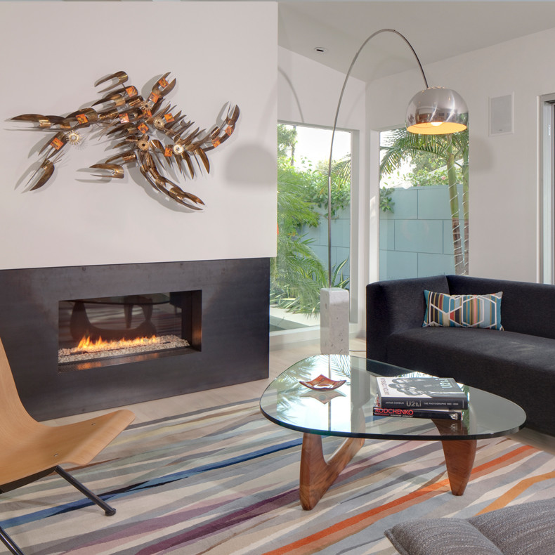 Design ideas for a contemporary open concept family room in New York with white walls, a ribbon fireplace and a metal fireplace surround.