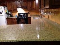 Inspiration for a mid-sized u-shaped eat-in kitchen remodel with quartz countertops