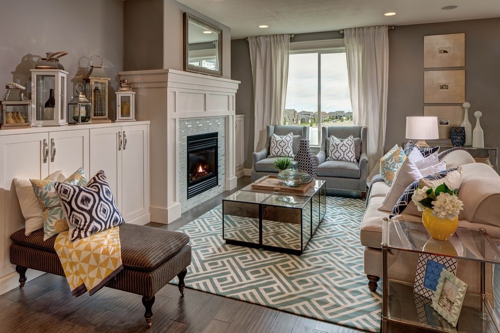 This is an example of a mid-sized traditional formal open concept living room in Minneapolis with grey walls, dark hardwood floors, a standard fireplace, a tile fireplace surround and brown floor.