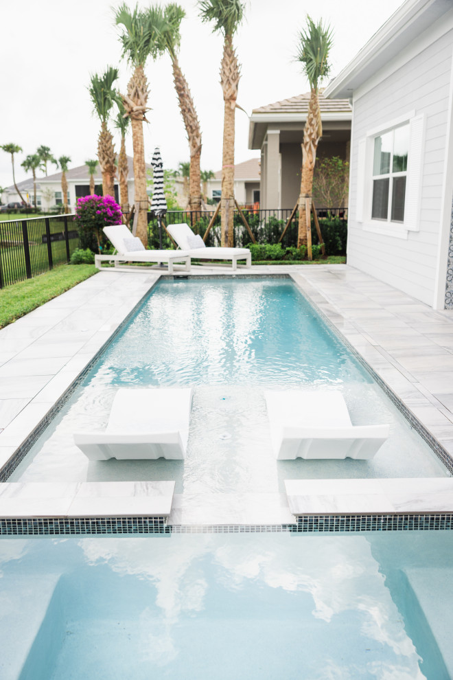 Photo of a beach style pool in Miami.