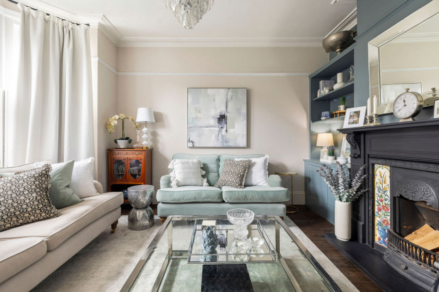 Calm & serene living room with a mix of chrome & brass metal accents traditional-living-room