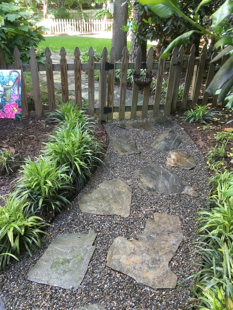 Mid-sized traditional side yard partial sun garden in Charlotte with a garden path and natural stone pavers for fall.