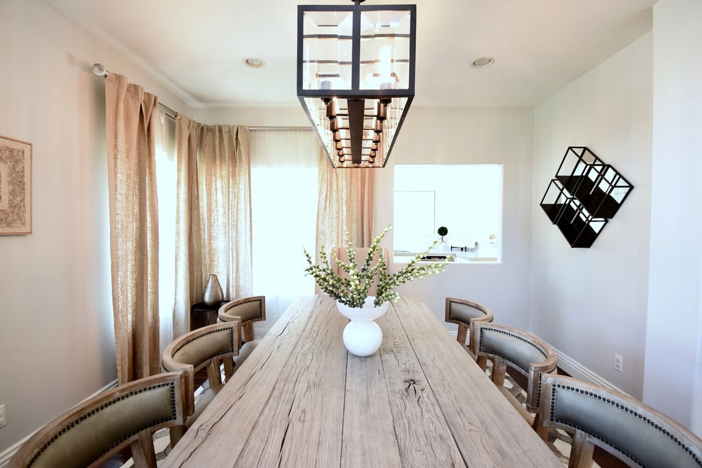 Example of a transitional dining room design in Orange County