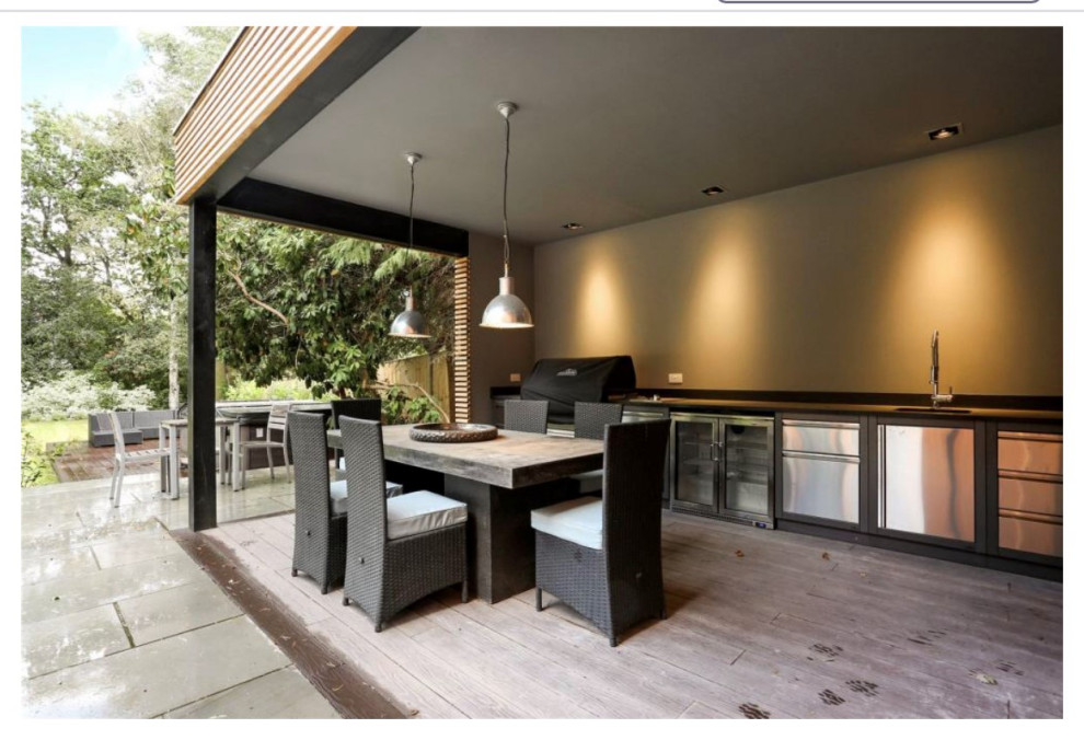 Outside kitchen , cedar clad with stainless steel units and Canadian BBQ