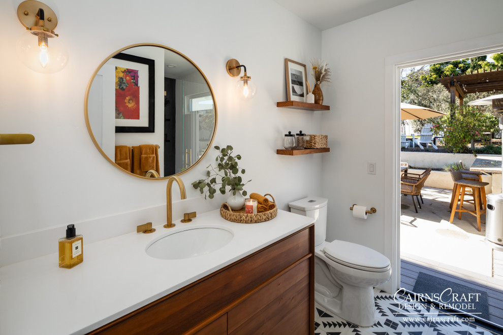 Inspiration for a medium sized modern shower room bathroom in San Diego with brown cabinets, a two-piece toilet, white walls, a submerged sink, a hinged door, a wall niche, a single sink and a freestanding vanity unit.