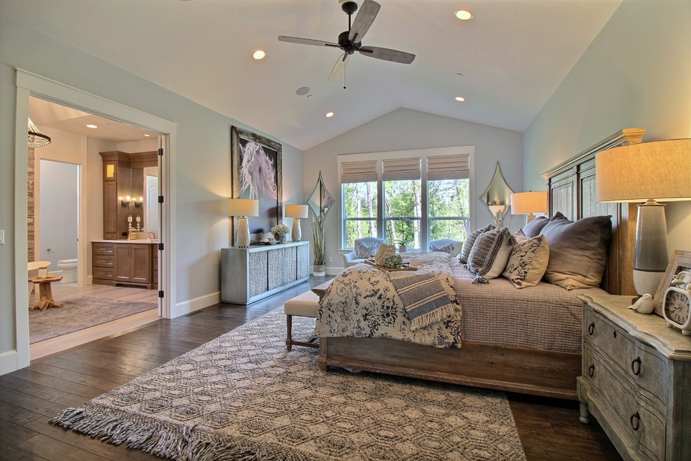 Design ideas for an expansive arts and crafts master bedroom in Portland with grey walls, dark hardwood floors and brown floor.