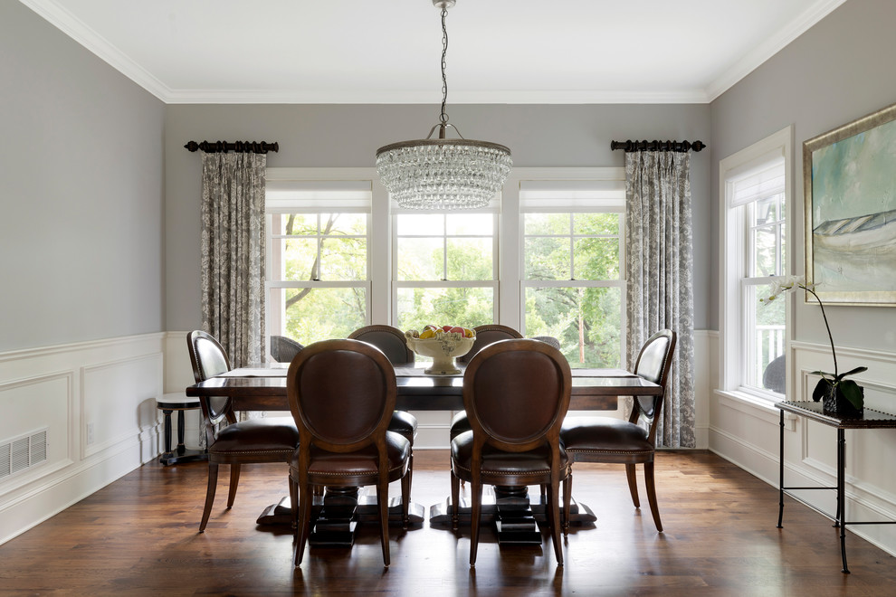 Traditional separate dining room in Minneapolis with grey walls, medium hardwood floors and brown floor.