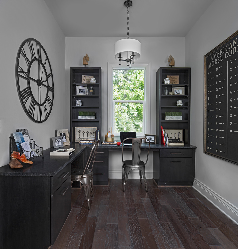 Photo of a transitional home office in Other with brown floor.