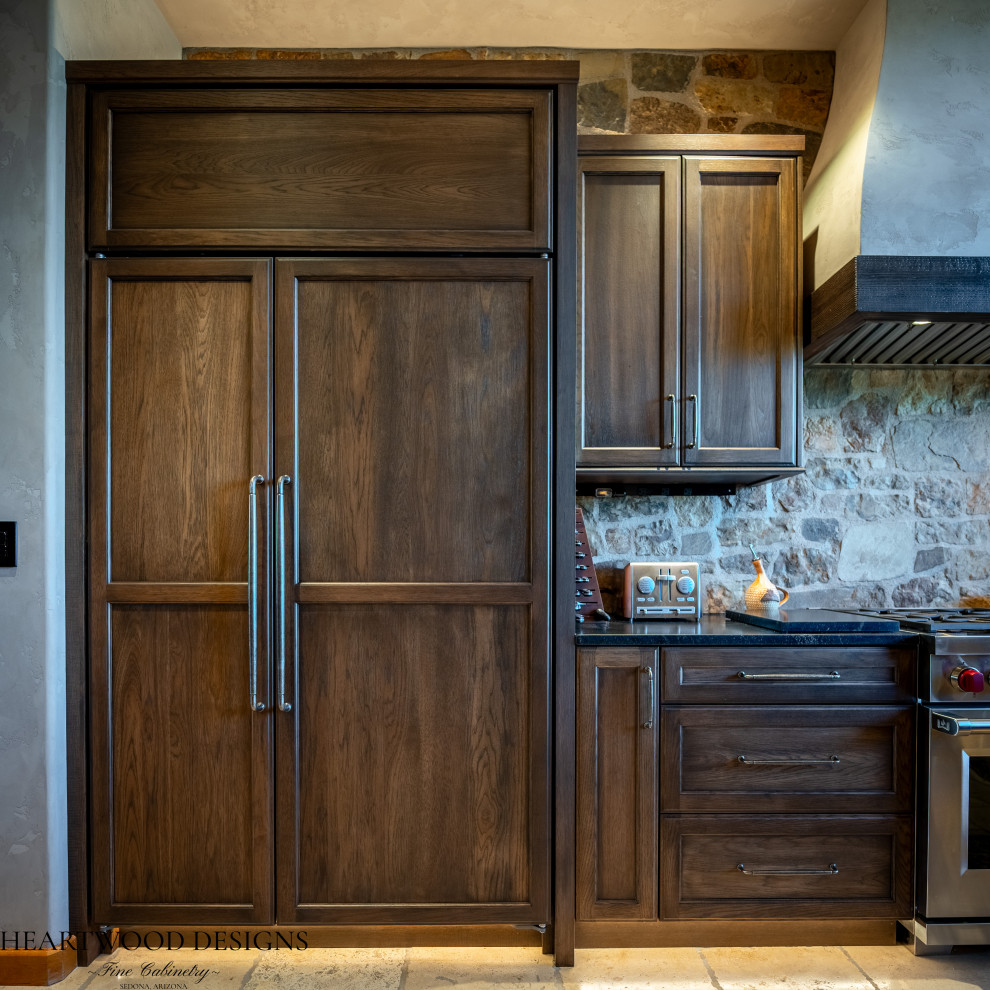 Inspiration for a transitional kitchen remodel with shaker cabinets, dark wood cabinets, paneled appliances and an island