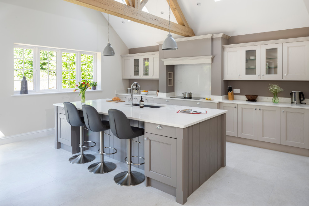 Design ideas for a mid-sized country l-shaped separate kitchen in Surrey with with island.