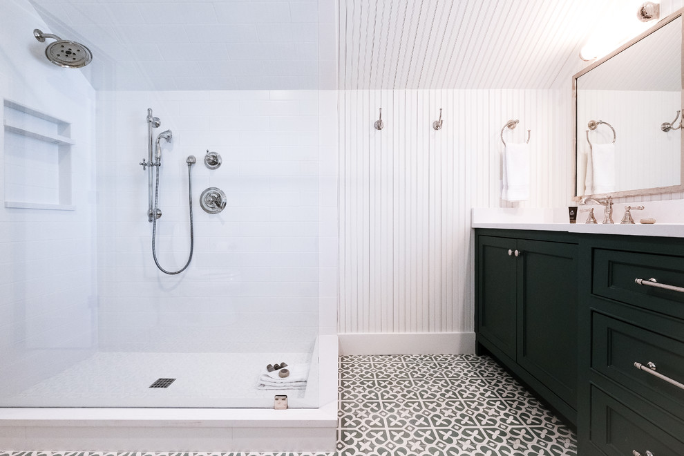 This is an example of a small traditional master bathroom with beaded inset cabinets, green cabinets, a corner shower, a two-piece toilet, white tile, ceramic tile, white walls, cement tiles, an undermount sink, engineered quartz benchtops, green floor, an open shower and white benchtops.