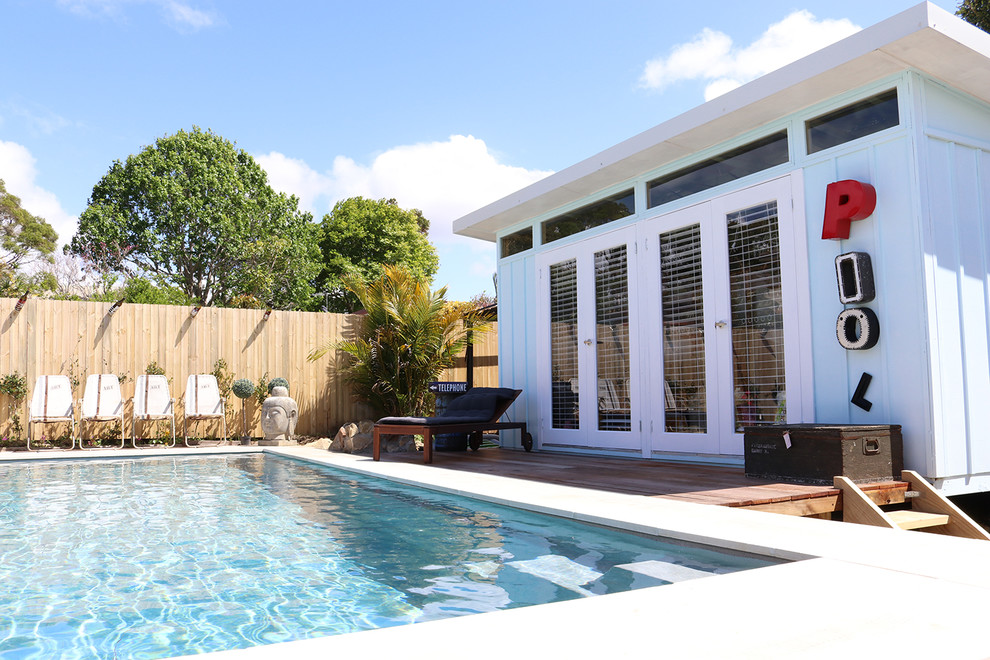 Inspiration for a mid-sized beach style backyard rectangular lap pool in Sydney with a pool house.