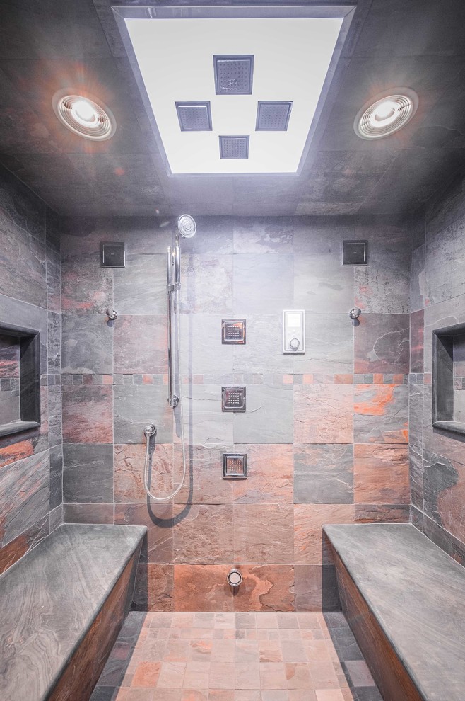 Inspiration for a country bathroom in New York with an alcove shower, gray tile and slate.