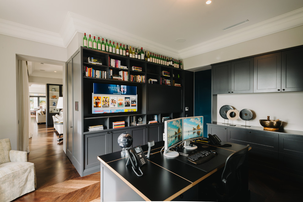 Photo of a mid-sized contemporary study room in Melbourne with white walls and a freestanding desk.
