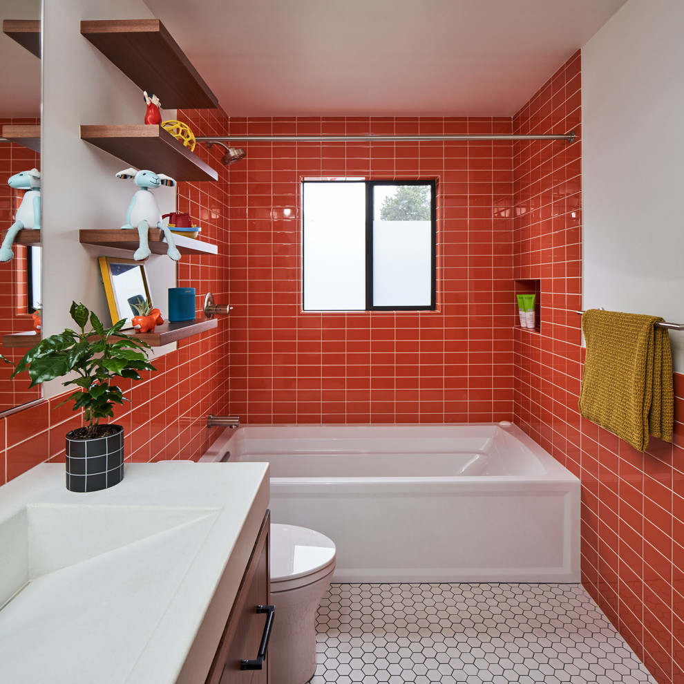 Inspiration for a mid-sized modern kids bathroom in Portland with flat-panel cabinets, medium wood cabinets, a shower/bathtub combo, orange tile, ceramic tile, engineered quartz benchtops, a shower curtain, a double vanity and a floating vanity.
