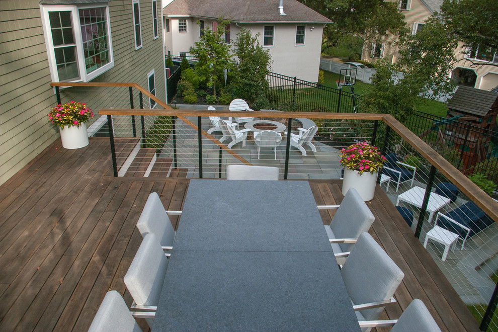 Photo of a mid-sized traditional backyard deck in Boston.