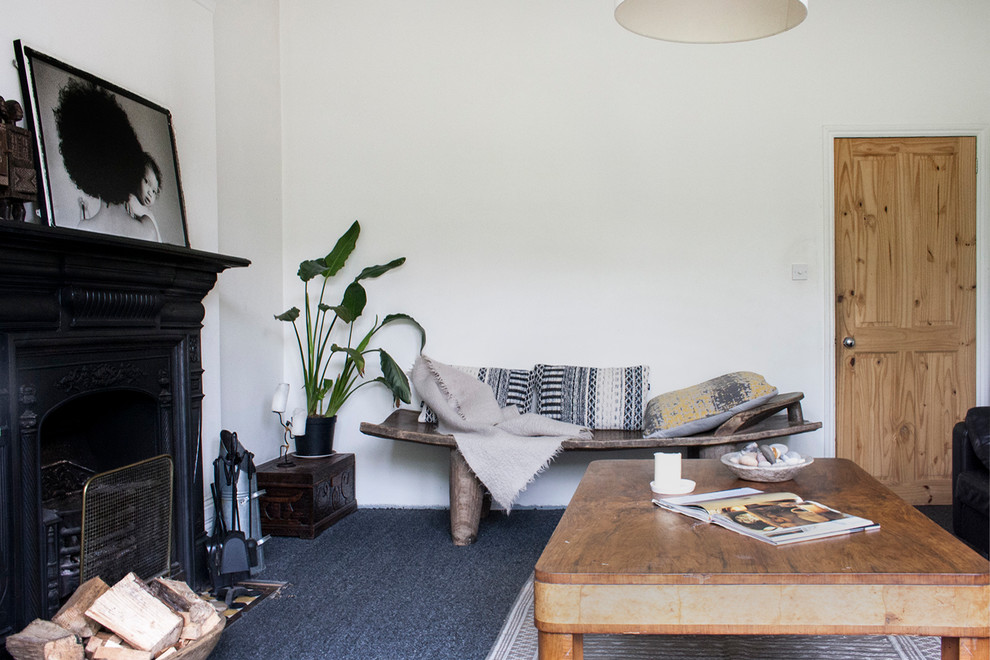 Design ideas for a medium sized contemporary enclosed living room in London with white walls, carpet, no tv and blue floors.