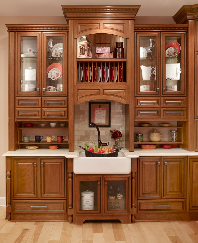 Inspiration for a mid-sized traditional single-wall kitchen pantry in Philadelphia with recessed-panel cabinets, beige cabinets, granite benchtops, brown splashback, marble splashback, with island and brown benchtop.