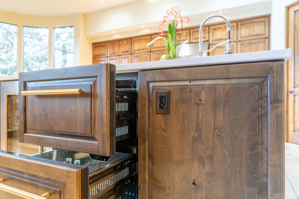 Kitchen - kitchen idea in Phoenix with raised-panel cabinets, medium tone wood cabinets and an island