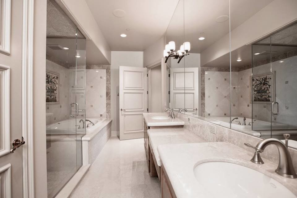 Inspiration for a large master bathroom in Las Vegas with a drop-in sink, medium wood cabinets, a hot tub, a corner shower, a one-piece toilet, beige tile and beige walls.