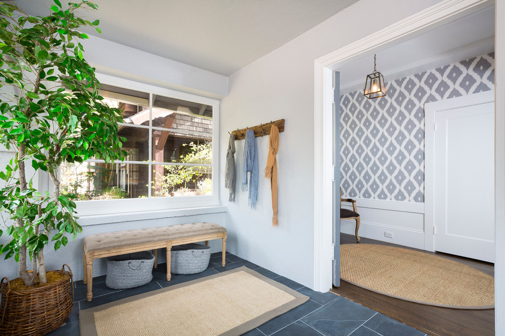 Inspiration for a transitional foyer in San Francisco with grey walls and slate floors.