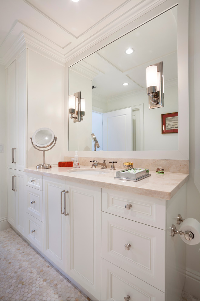 Inspiration for a large transitional mosaic tile floor and multicolored floor bathroom remodel in Miami with recessed-panel cabinets, white cabinets, white walls, a drop-in sink, marble countertops and beige countertops