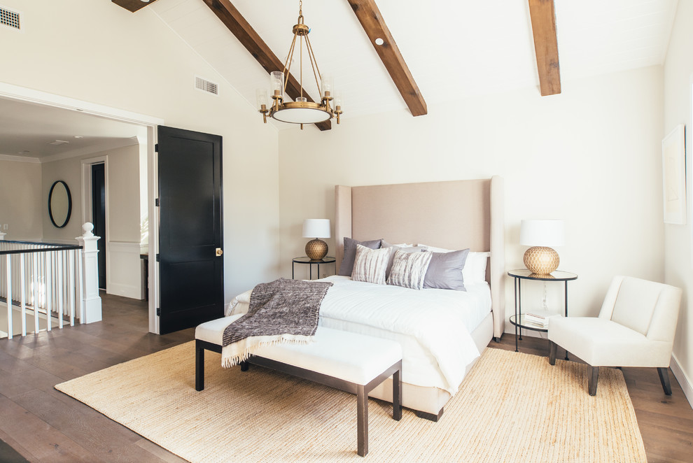 Country bedroom in Los Angeles with beige walls, light hardwood floors and brown floor.