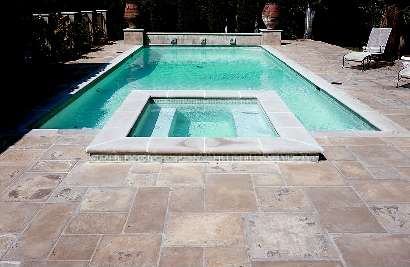 Inspiration for a large courtyard custom-shaped natural pool in Austin with a water slide and concrete pavers.