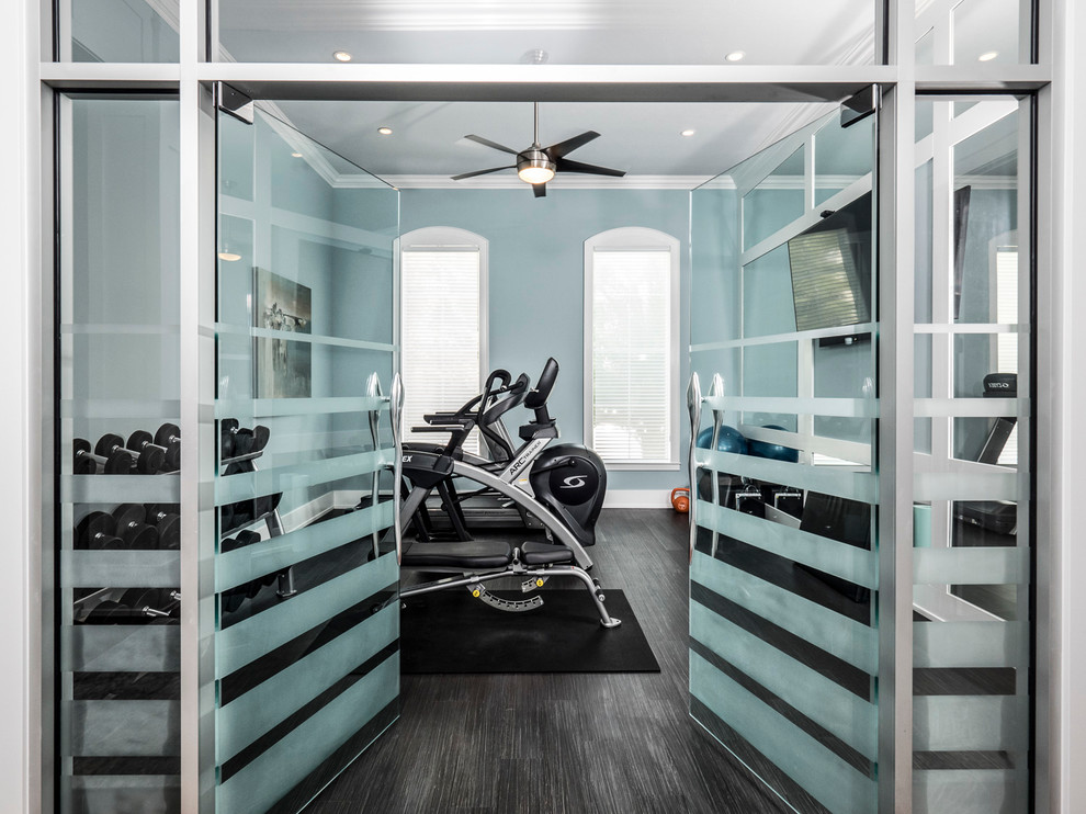 Mid-sized home weight room in Miami with blue walls, vinyl floors and grey floor.