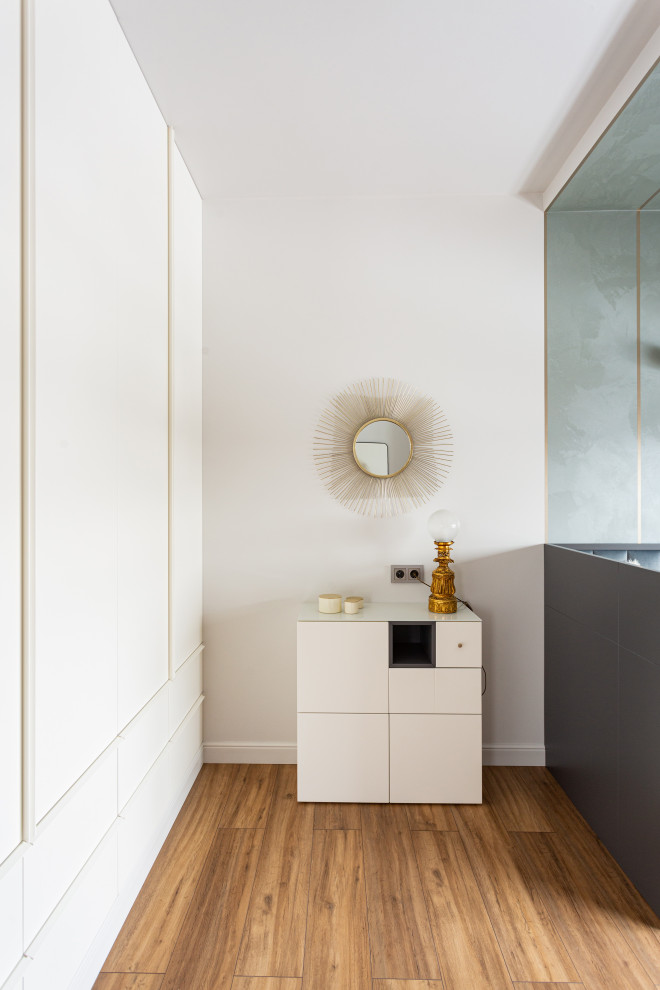 Inspiration for a medium sized contemporary guest bedroom in Yekaterinburg with white walls, laminate floors, beige floors and a drop ceiling.