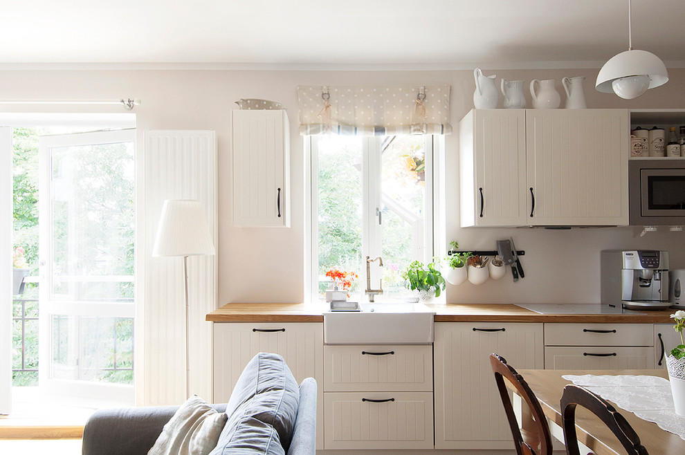 Photo of a contemporary kitchen in Other with a farmhouse sink.