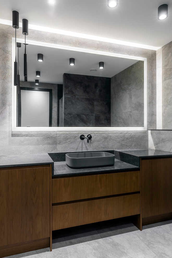Inspiration for a contemporary bathroom in Moscow with flat-panel cabinets, dark wood cabinets, a vessel sink, grey benchtops, a single vanity and a freestanding vanity.