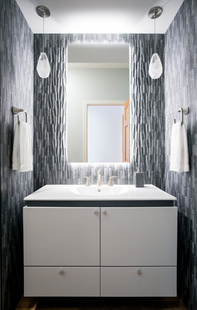 Large contemporary master bathroom in Minneapolis with flat-panel cabinets, a freestanding tub, a corner shower, a one-piece toilet, grey walls, porcelain floors, marble benchtops, grey floor, a hinged shower door, a shower seat, a floating vanity, white cabinets, gray tile, stone tile, an undermount sink and a single vanity.