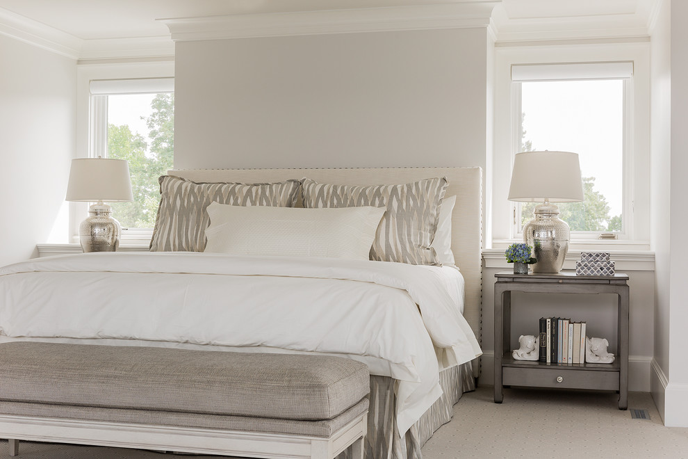 Photo of a beach style bedroom in Boston with grey walls and carpet.