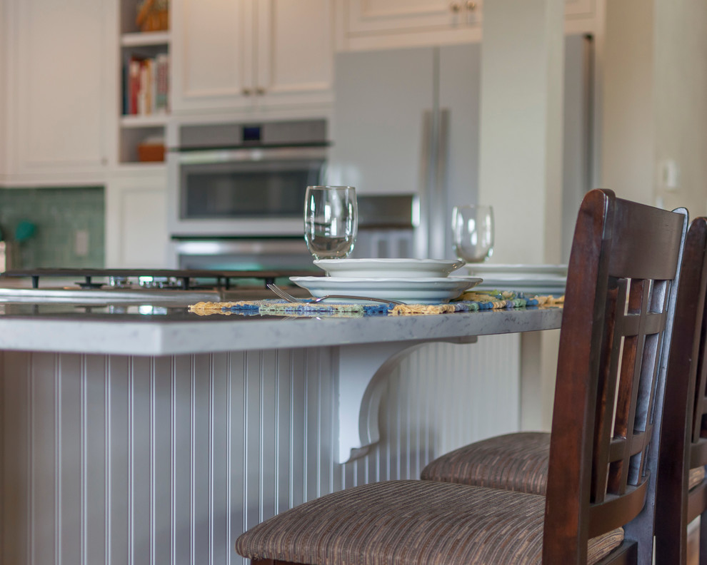 Eat-in kitchen - mid-sized transitional medium tone wood floor eat-in kitchen idea in Denver with a single-bowl sink, flat-panel cabinets, yellow cabinets, quartz countertops, blue backsplash, glass tile backsplash, white appliances and an island