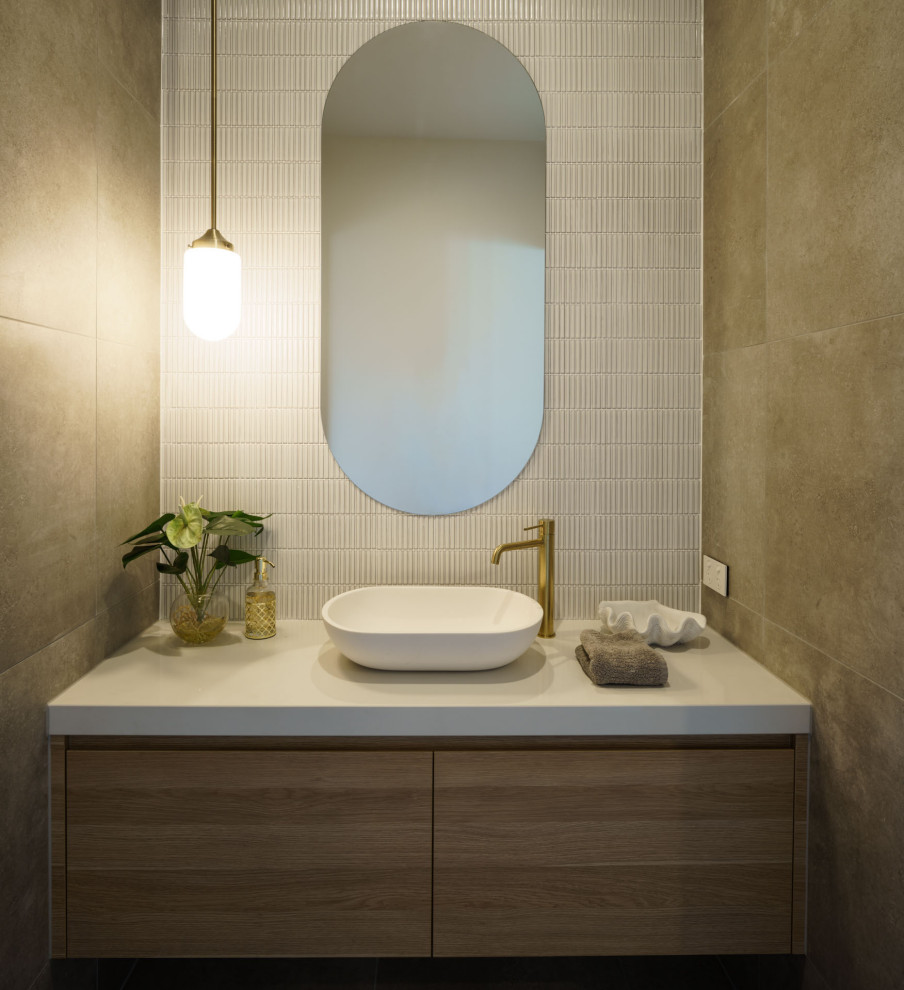This is an example of a beach style powder room in Sunshine Coast.