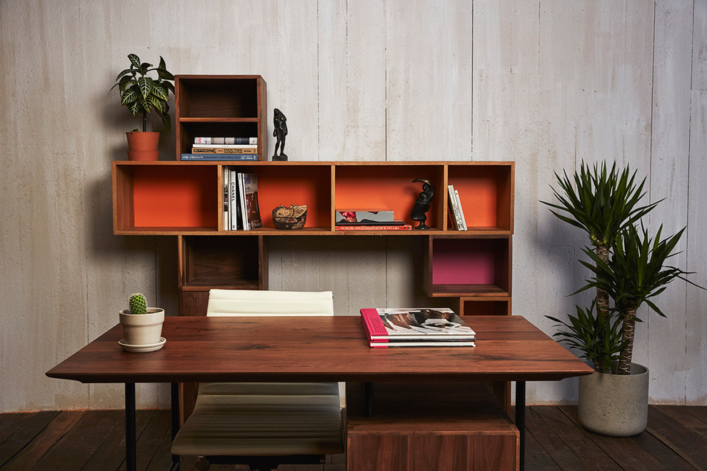 Inspiration for a mid-sized midcentury study room in San Diego with white walls, dark hardwood floors, no fireplace, a freestanding desk and brown floor.