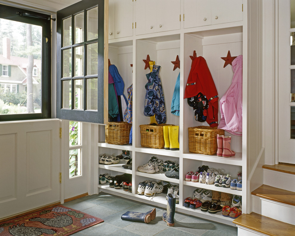 Photo of a traditional mudroom in Portland Maine with a dutch front door.